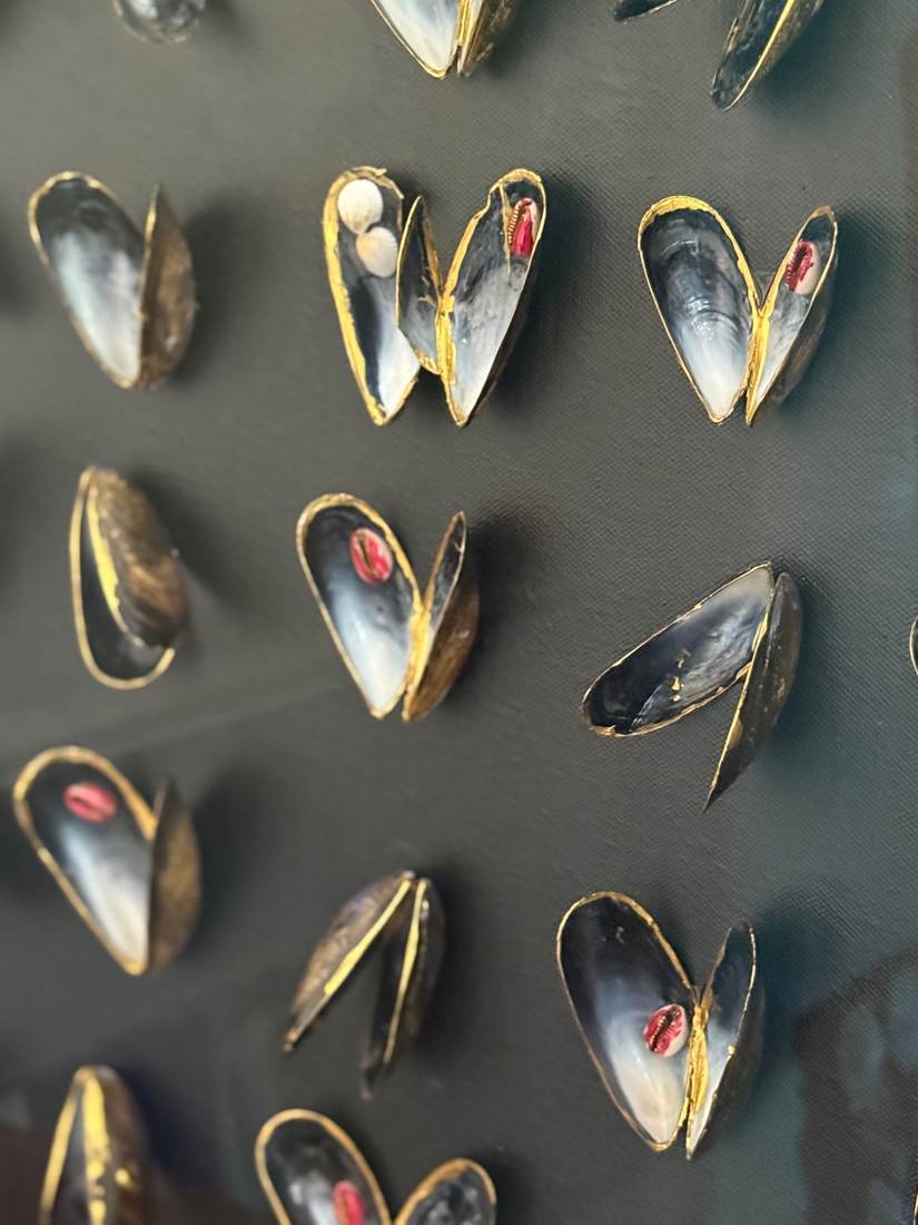 Close-up of Max's Muscles showing shell forms and symbolic details