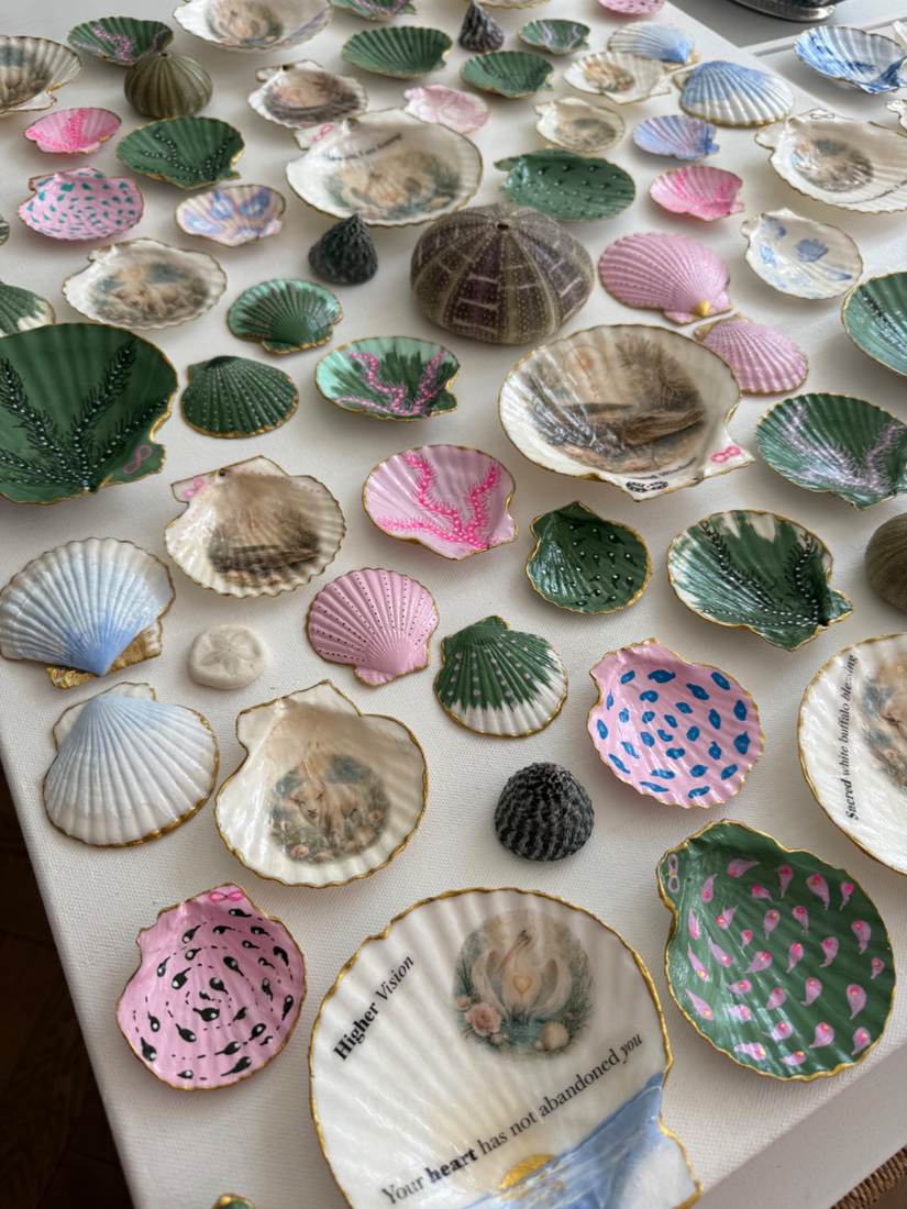 Close-up detail of Sacred Waters showing layered shells and symbolic messages